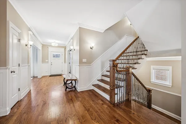 a view of entryway with wooden floor
