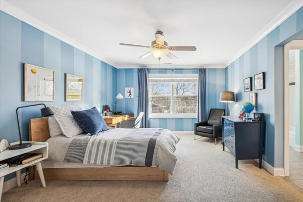 a bedroom with a bed gym equipment and a window