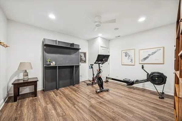 a view of a room with gym equipment and a window
