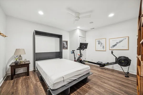 a bedroom with a bed and a table