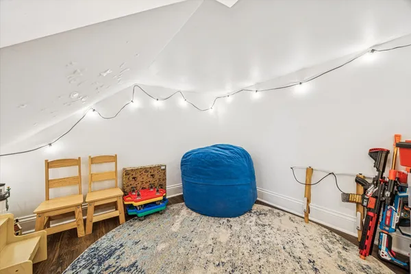 a bedroom with furniture and a window