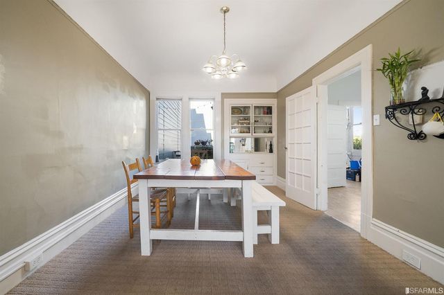 a view of a room with workspace and windows