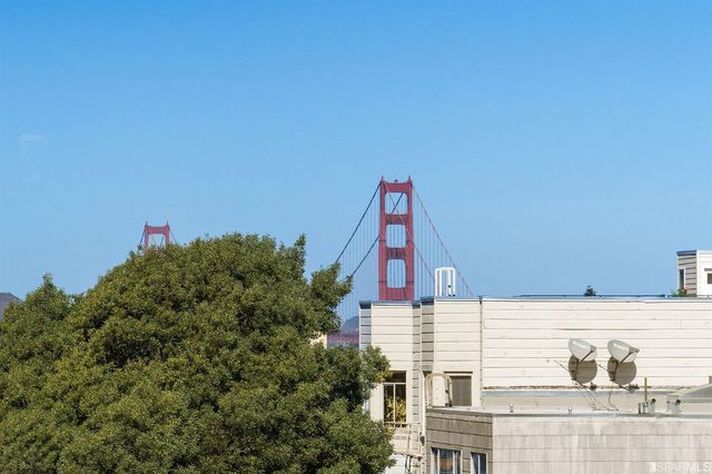 a view of a tall building from a balcony
