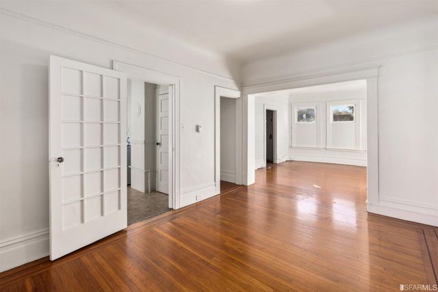 a view of a livingroom with wooden floor