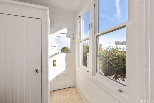 a bathroom with a glass shower door
