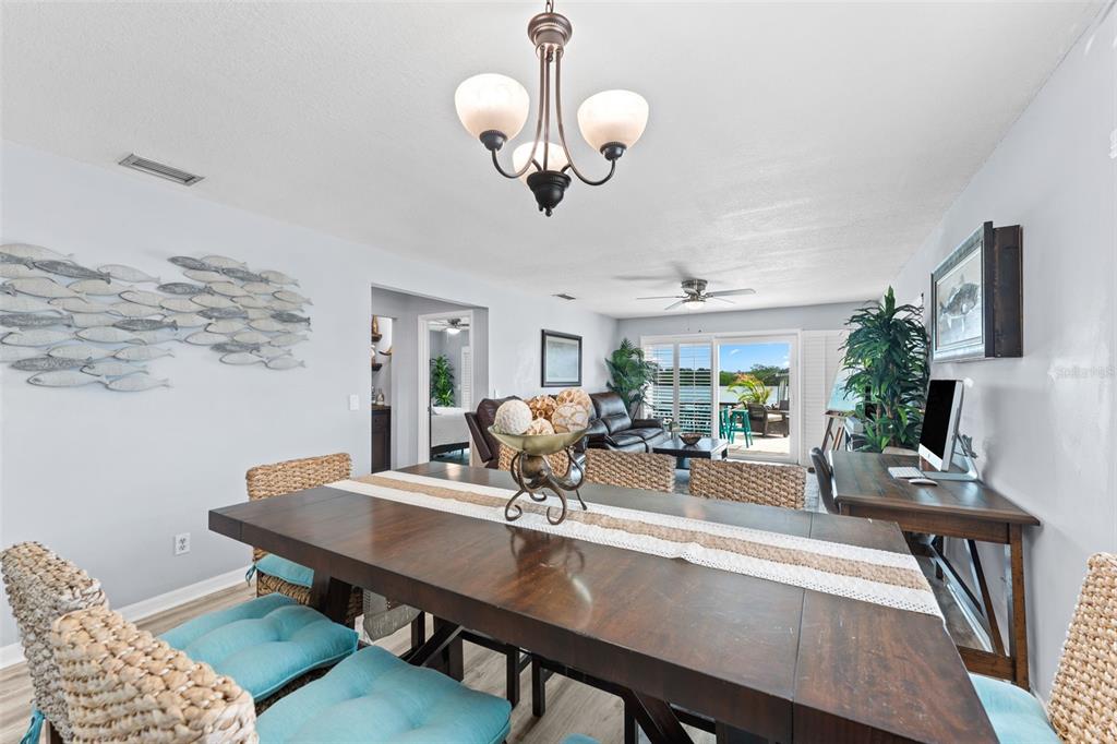 29 Pelican Lane Edgewater, FL 32141 - Photo 7 of 39 a view of a dining room with furniture and wooden floor