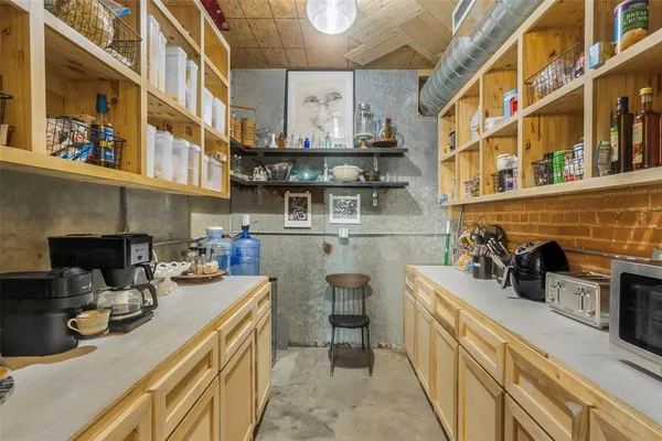 a kitchen with a sink and cabinets