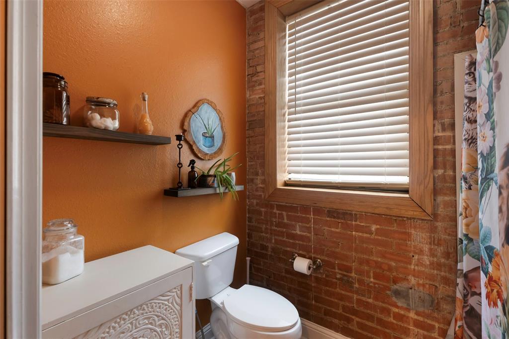 110 West Main Street Cumby, TX 75433 - Photo 20 of 23 a bathroom with a toilet and a sink