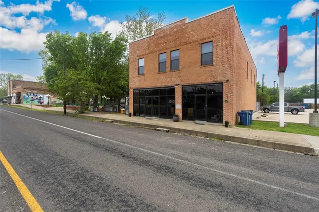 a view of a house with a street