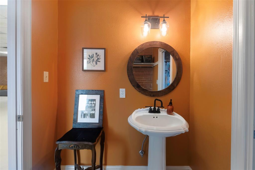 110 West Main Street Cumby, TX 75433 - Photo 21 of 23 a bathroom with a sink and a mirror