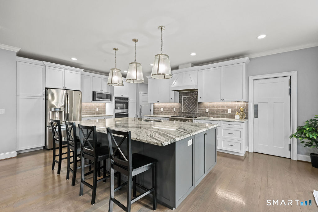 399 Hill Road Harwinton, CT 06791 - Photo 7 of 37 a kitchen with appliances a sink and cabinets