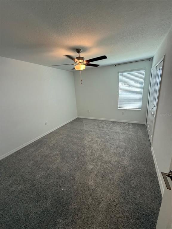 4461 Cozy Condor Court Bartow, FL 33830 - Photo 12 of 15 an empty room with a ceiling fan and window