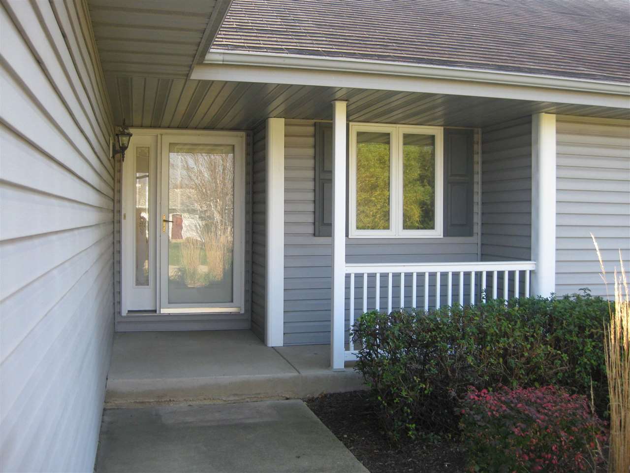 7017 Rye Ridge Trail Cherry Valley, IL 61016 - Photo 2 of 20 a view of a house with a small porch