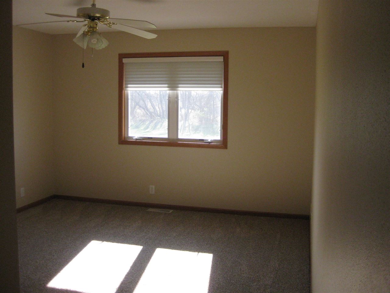 7017 Rye Ridge Trail Cherry Valley, IL 61016 - Photo 8 of 20 an empty room with a window