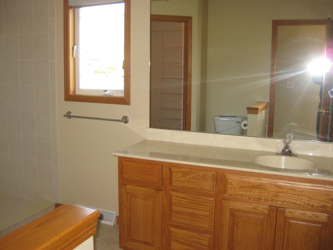7017 Rye Ridge Trail Cherry Valley, IL 61016 - Photo 10 of 20 a bathroom with a sink and a mirror