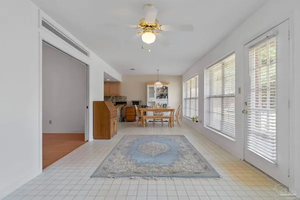 a dining room with furniture and window