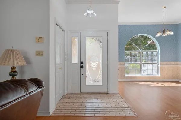 a view of empty room with a large window