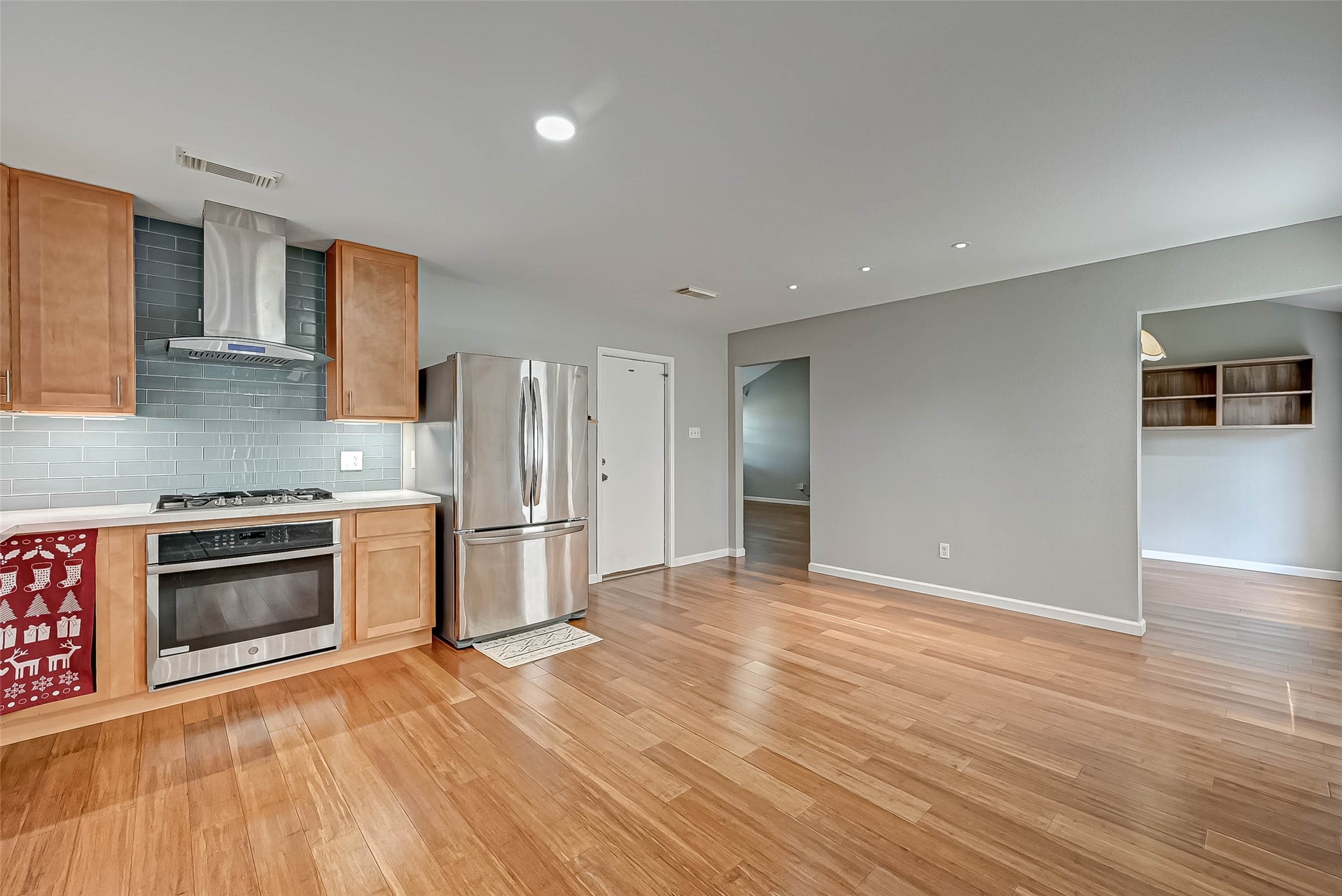 9466 Coast Bridge Street Houston, TX 77075 - Photo 12 of 29 a kitchen with granite countertop a refrigerator and a stove top oven