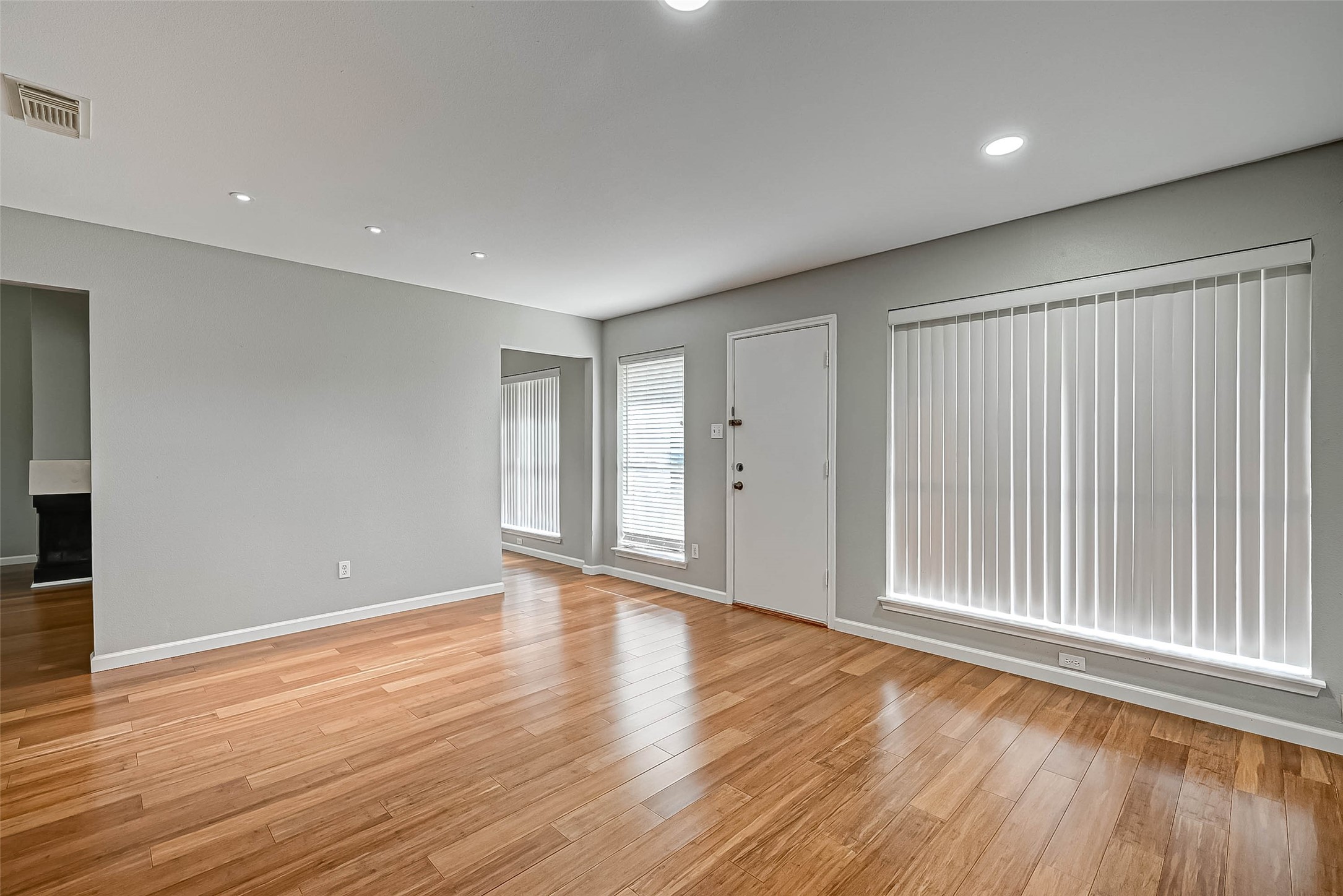 9466 Coast Bridge Street Houston, TX 77075 - Photo 13 of 29 a view of an empty room with wooden floor and a window