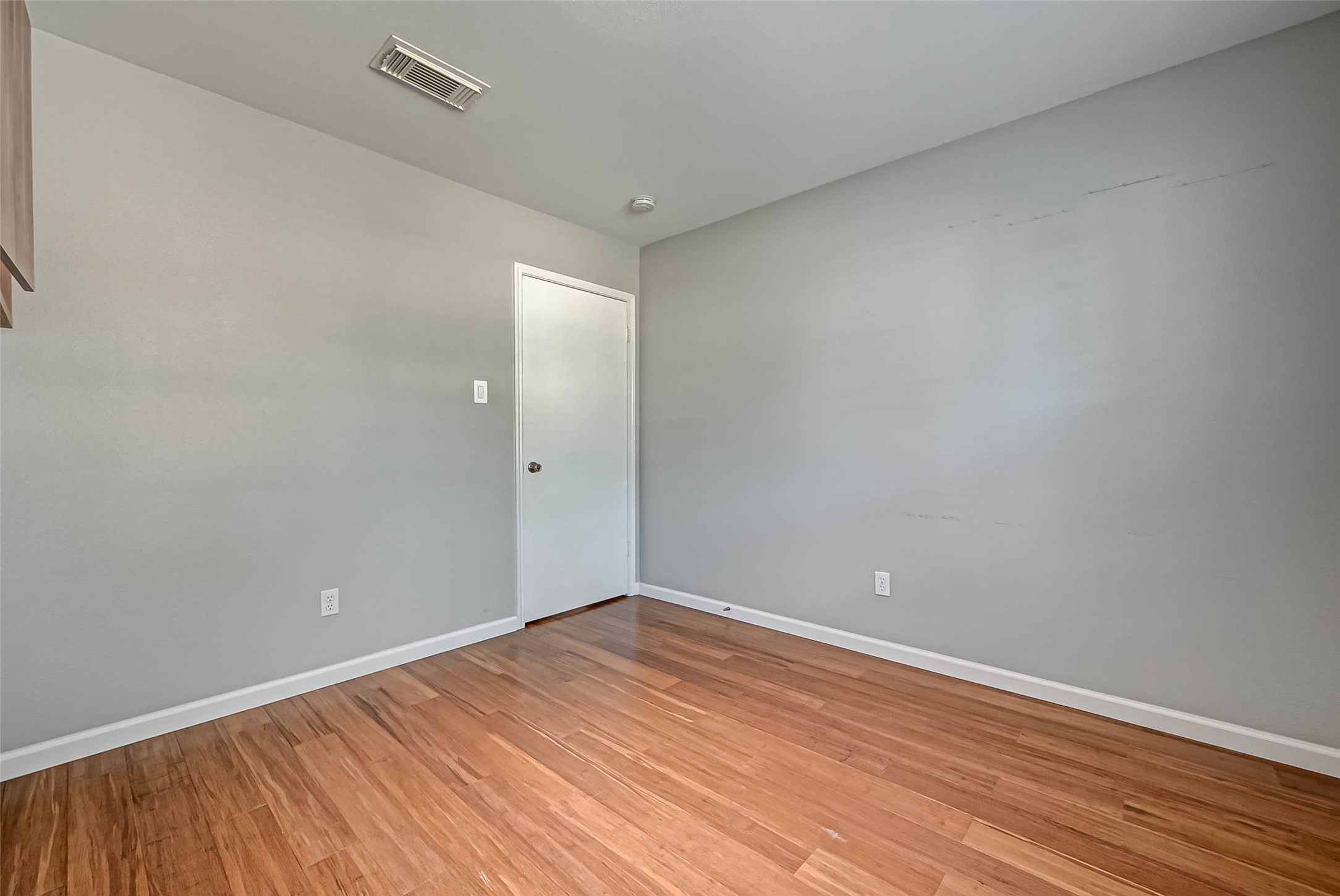 9466 Coast Bridge Street Houston, TX 77075 - Photo 17 of 29 a view of empty room with wooden floor