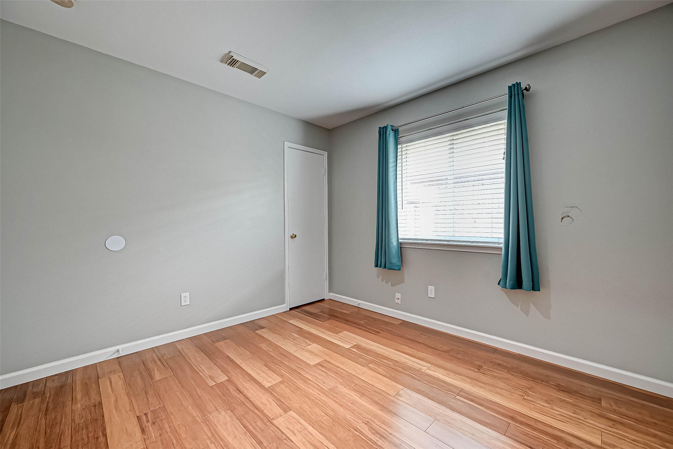 9466 Coast Bridge Street Houston, TX 77075 - Photo 20 of 29 a view of empty room with wooden floor and fan