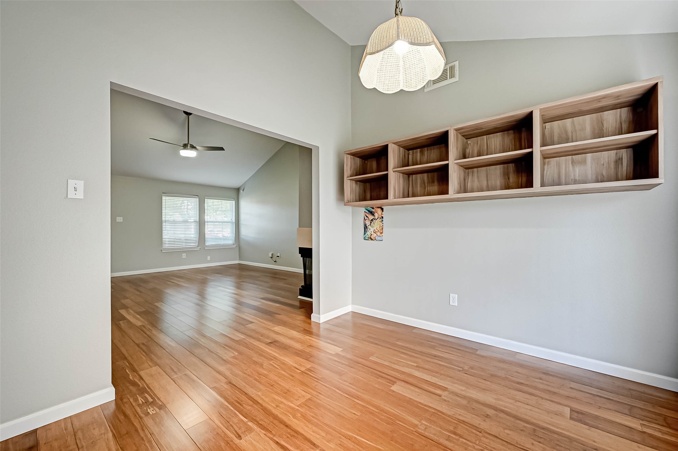 9466 Coast Bridge Street Houston, TX 77075 - Photo 8 of 29 a view of an empty room with wooden floor and a window