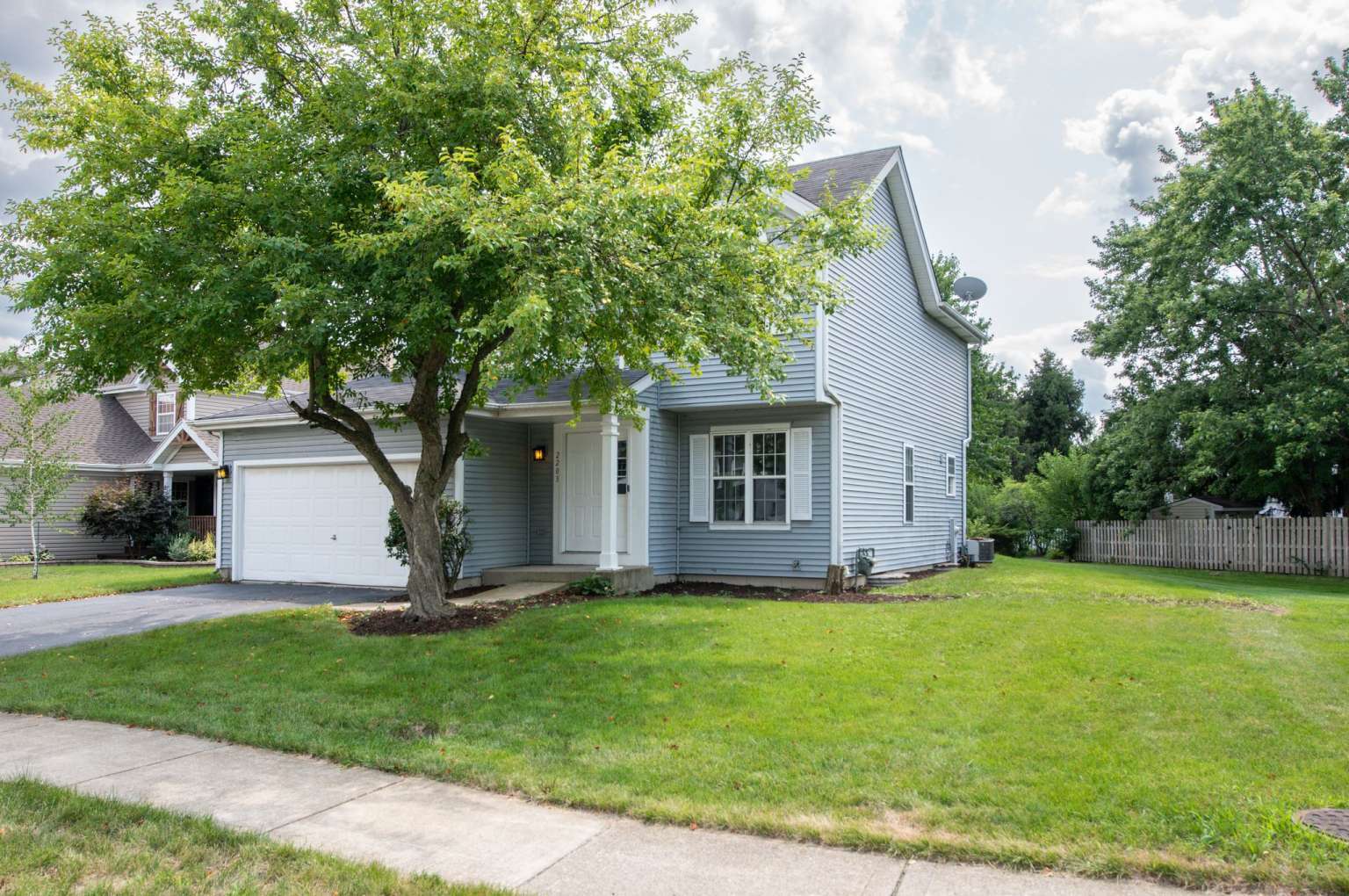 a view of a house with a yard