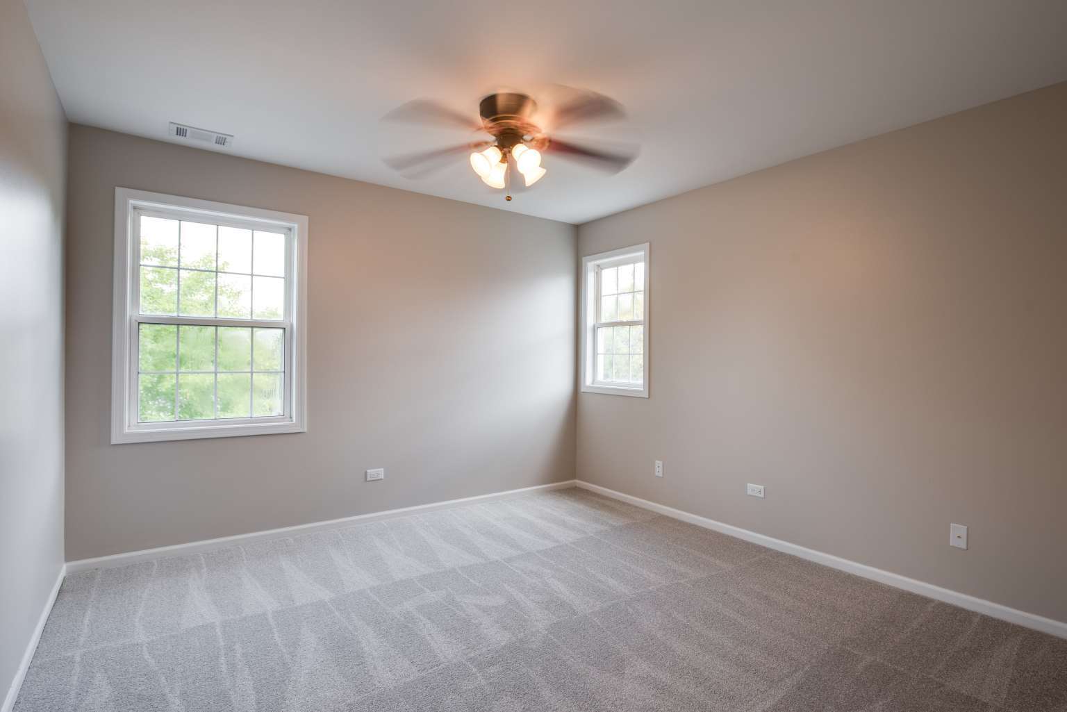 2203 Riverside Drive Plainfield, IL 60586 - Photo 22 of 25 an empty room with a window and a fan
