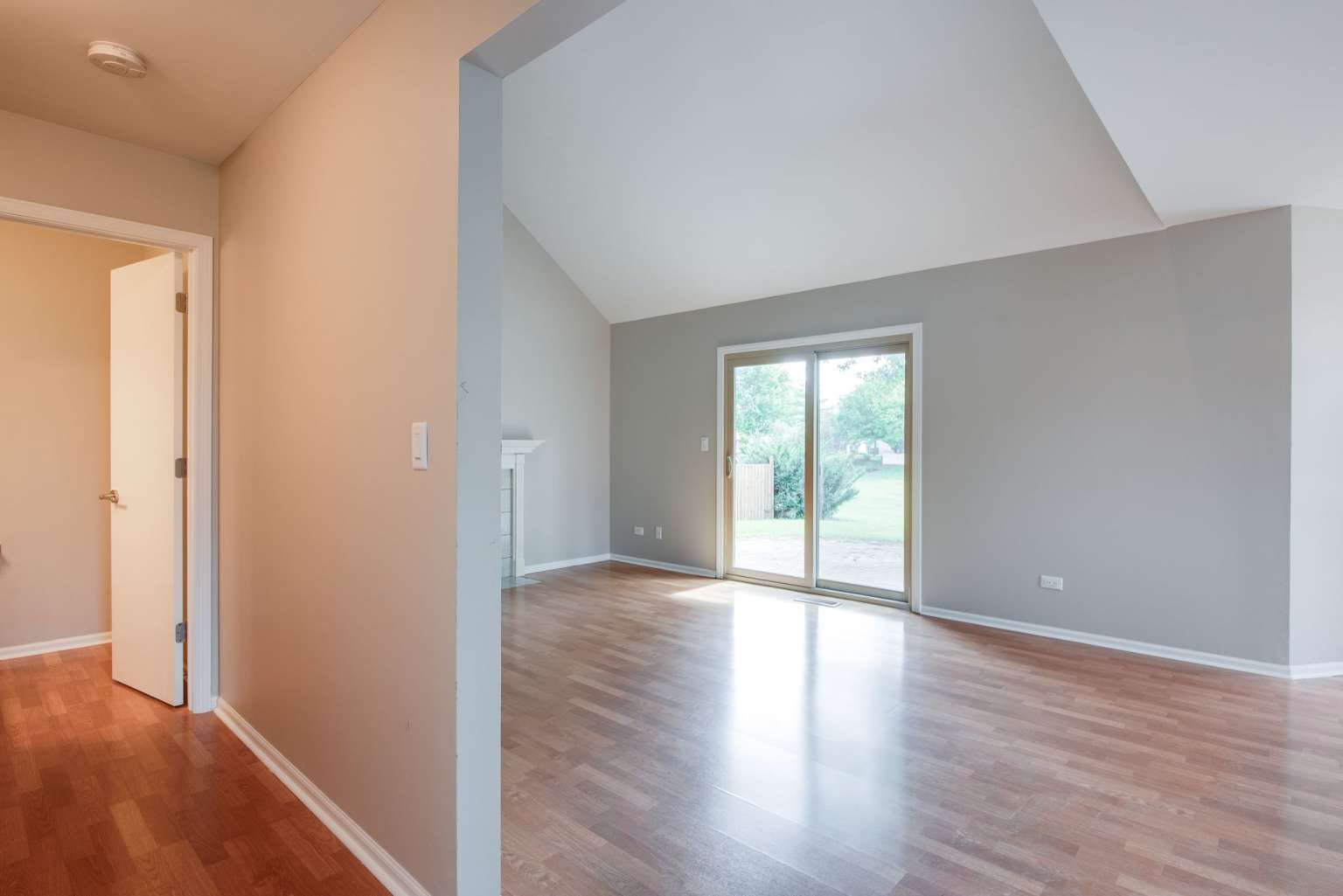 2203 Riverside Drive Plainfield, IL 60586 - Photo 7 of 25 wooden floor in an empty room with a window