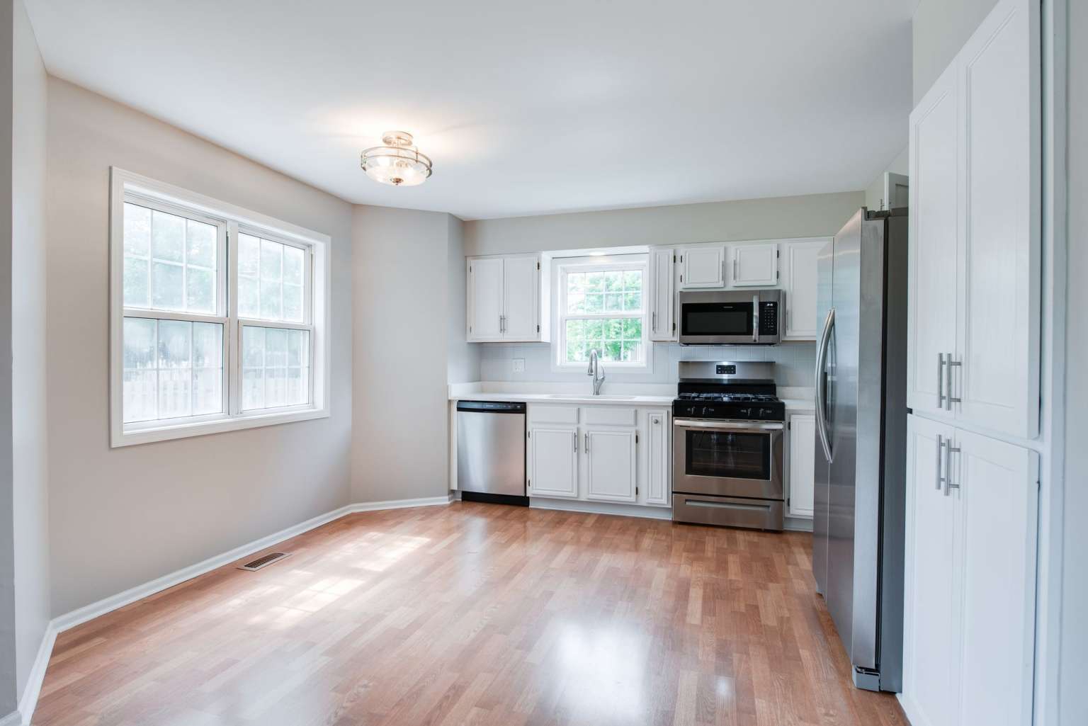 2203 Riverside Drive Plainfield, IL 60586 - Photo 10 of 25 a kitchen with a refrigerator and a stove top oven