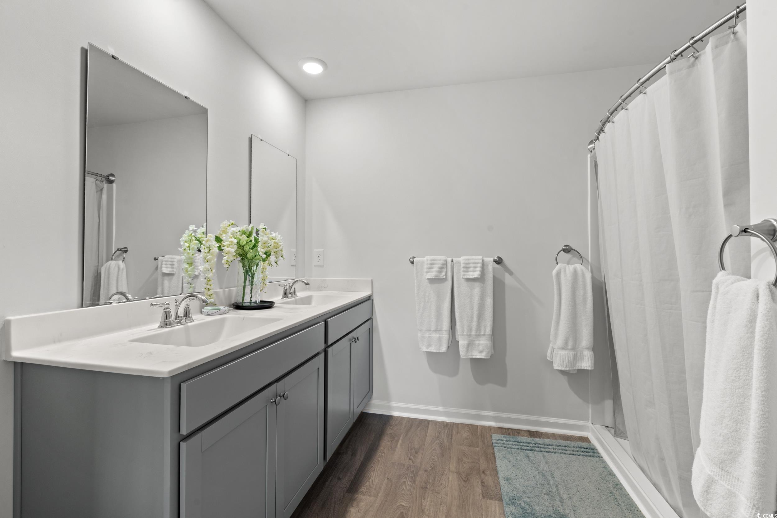 514 Strawberry Field Way Galivants Ferry, SC 29544 - Photo 11 of 37 Full bath with a shower stall, dark wood finished floors, double vanity, and recessed lighting