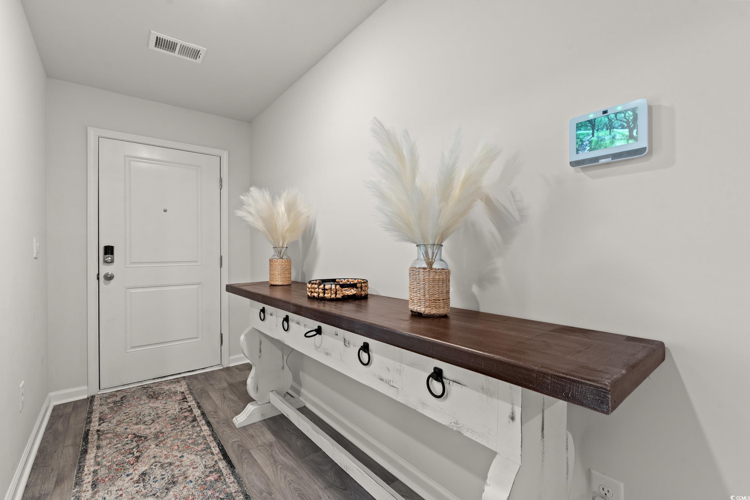 514 Strawberry Field Way Galivants Ferry, SC 29544 - Photo 19 of 37 Doorway to outside featuring wood finished floors and baseboards