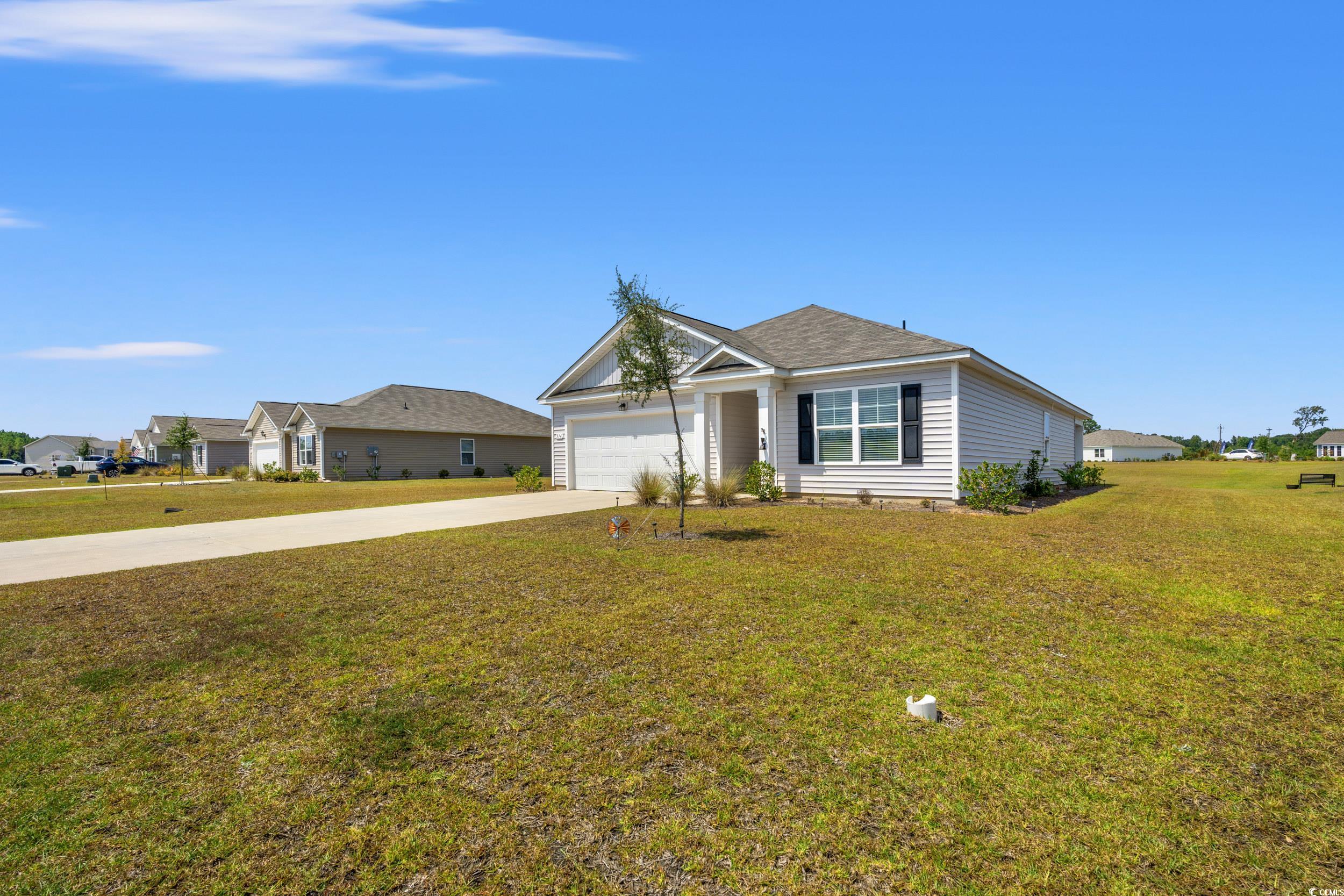 514 Strawberry Field Way Galivants Ferry, SC 29544 - Photo 21 of 37 Ranch-style house featuring driveway, a front yard, and an attached garage