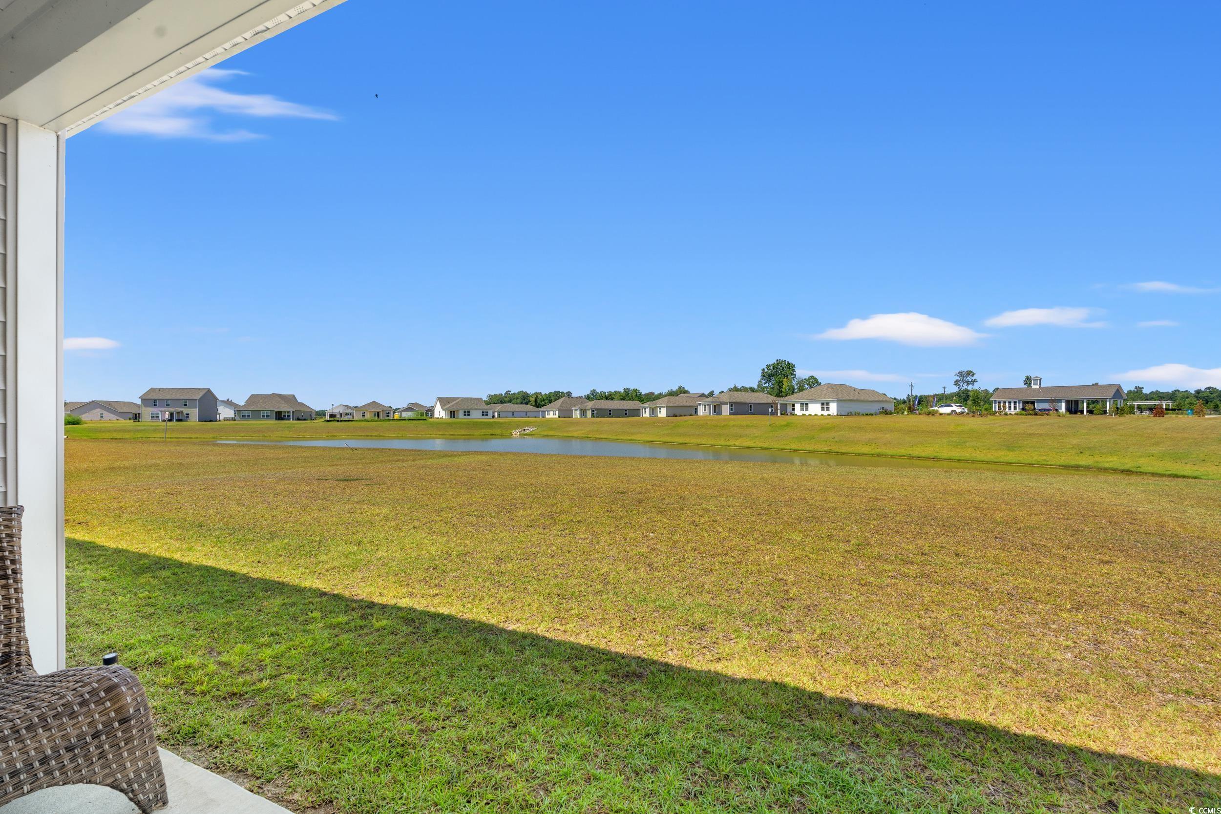 514 Strawberry Field Way Galivants Ferry, SC 29544 - Photo 23 of 37 View of green lawn with a water view and a residential view