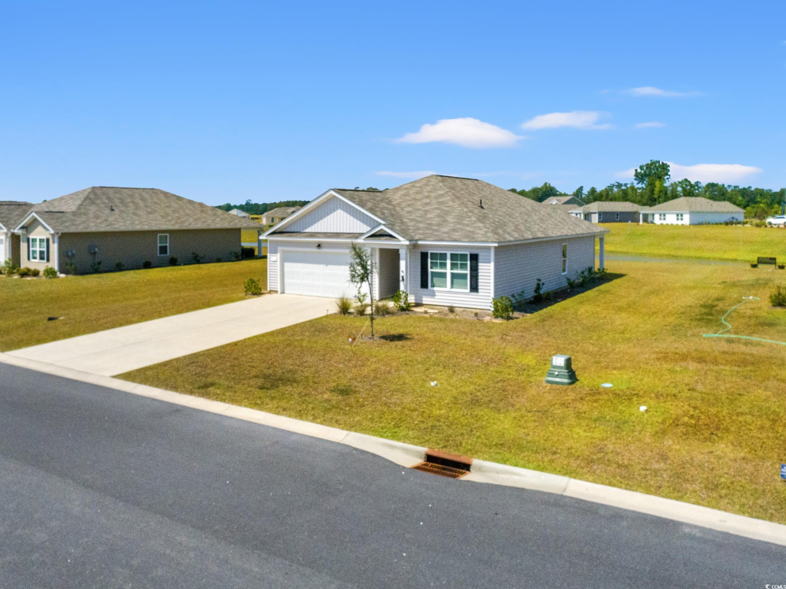 514 Strawberry Field Way Galivants Ferry, SC 29544 - Photo 29 of 37 Ranch-style home featuring driveway, a front yard, an attached garage, and roof with shingles