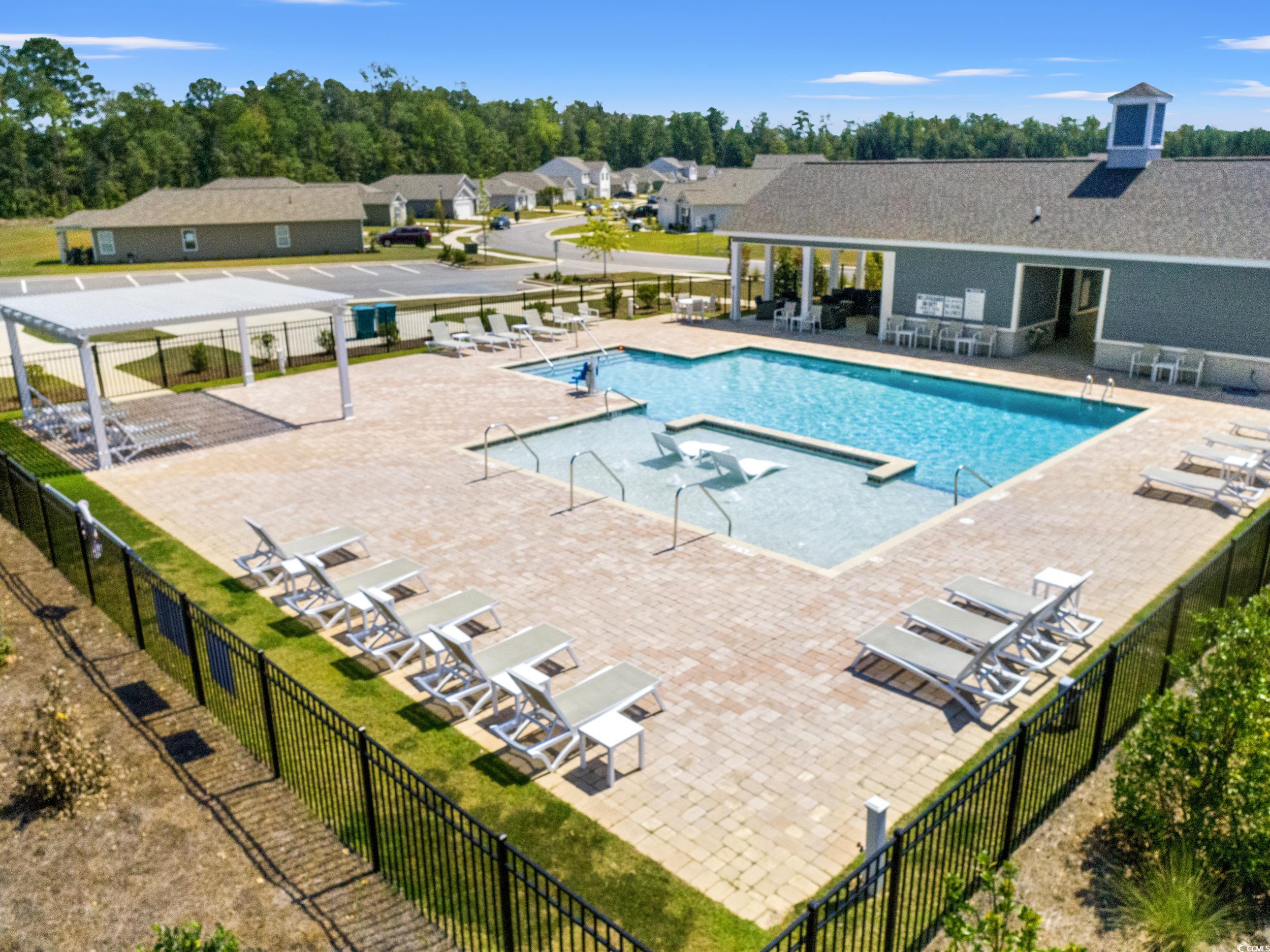 514 Strawberry Field Way Galivants Ferry, SC 29544 - Photo 33 of 37 Community pool featuring a patio area and a residential view