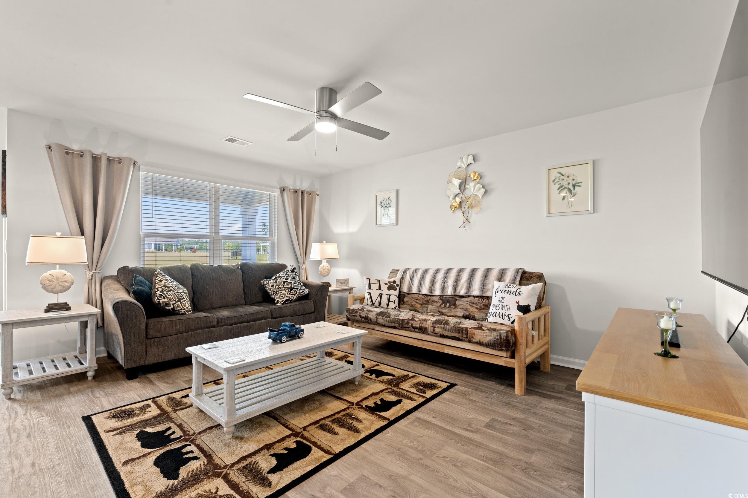 514 Strawberry Field Way Galivants Ferry, SC 29544 - Photo 5 of 37 Living room with light wood finished floors and ceiling fan