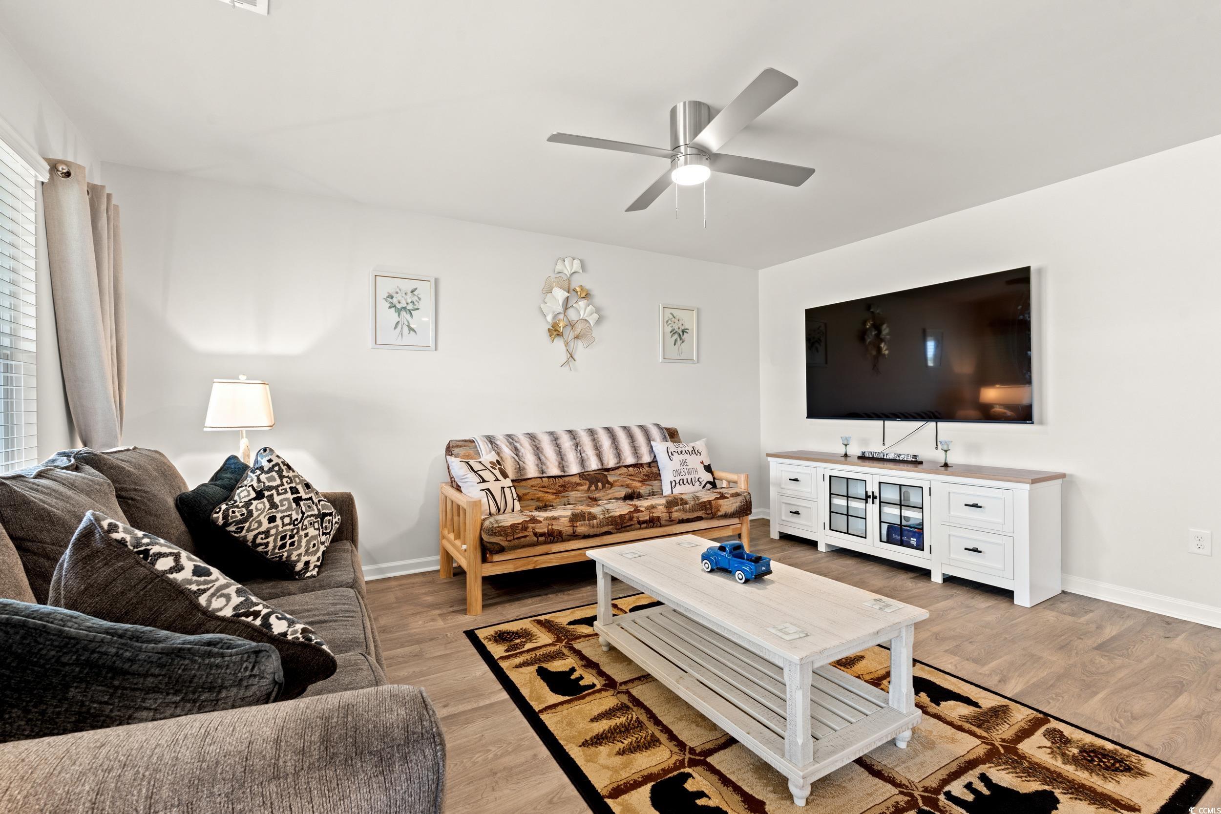 514 Strawberry Field Way Galivants Ferry, SC 29544 - Photo 6 of 37 Living room with light wood-style flooring and a ceiling fan