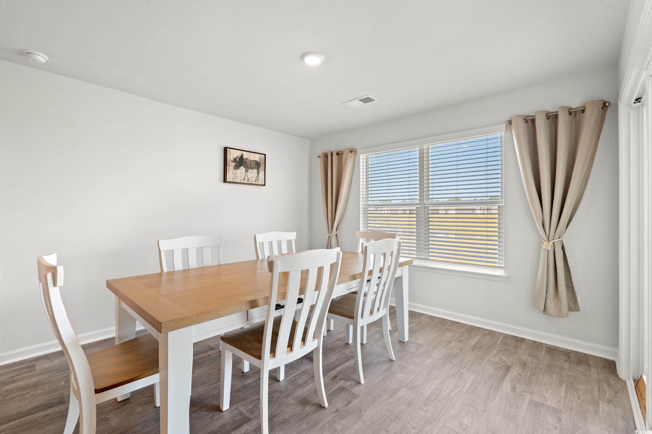514 Strawberry Field Way Galivants Ferry, SC 29544 - Photo 7 of 37 Dining room featuring light wood finished floors and baseboards