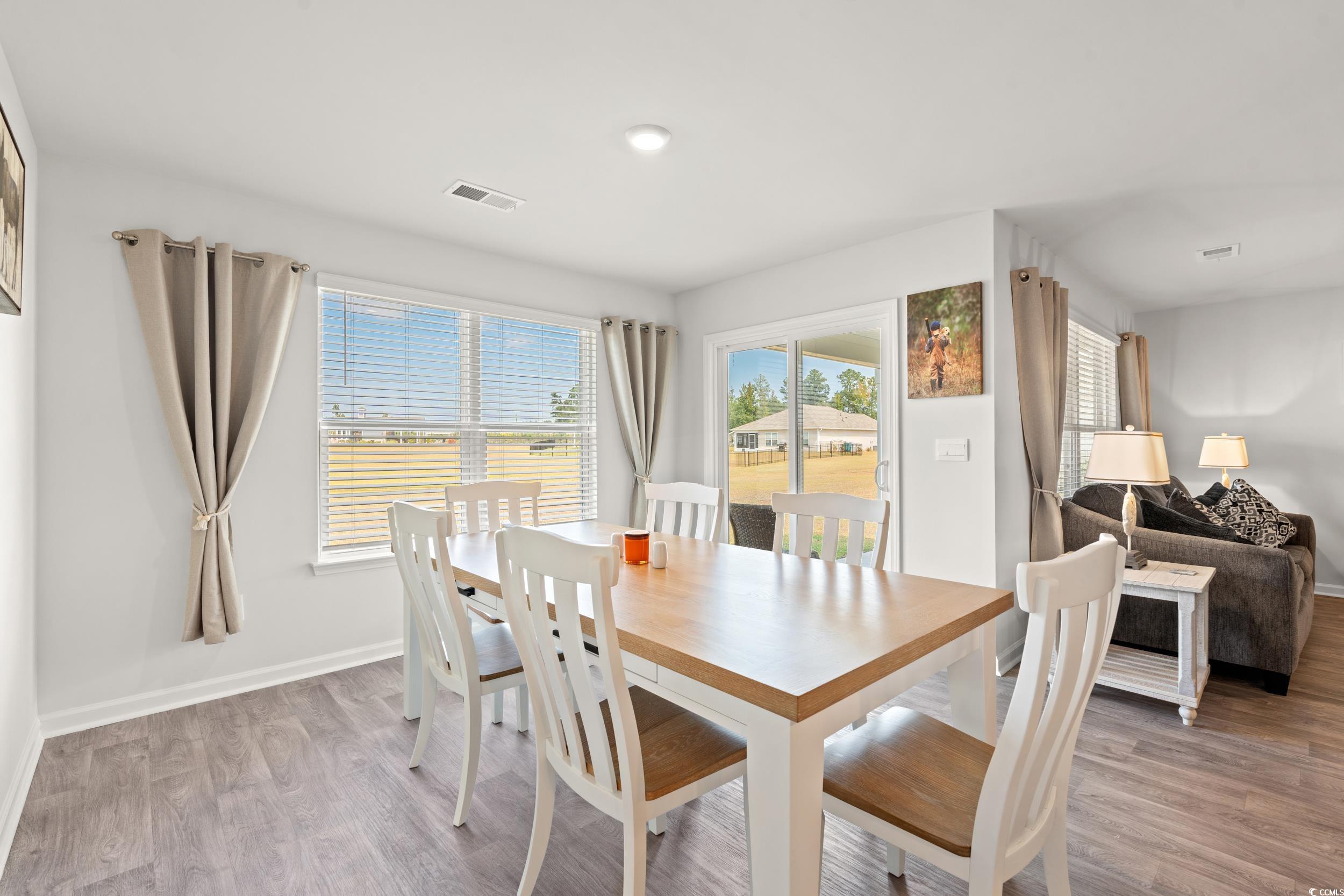 514 Strawberry Field Way Galivants Ferry, SC 29544 - Photo 8 of 37 Dining space featuring light wood-style floors and baseboards