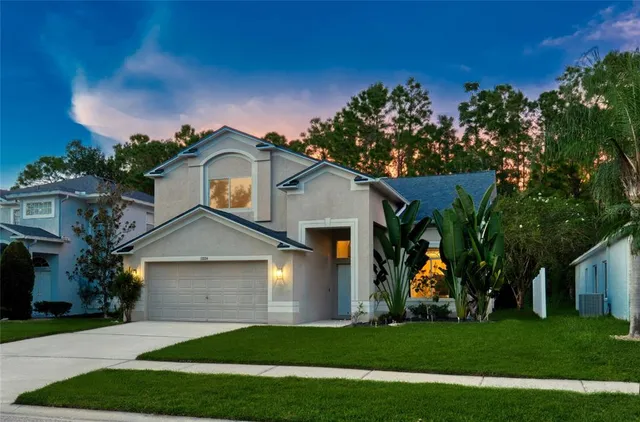 a view of a house with a yard