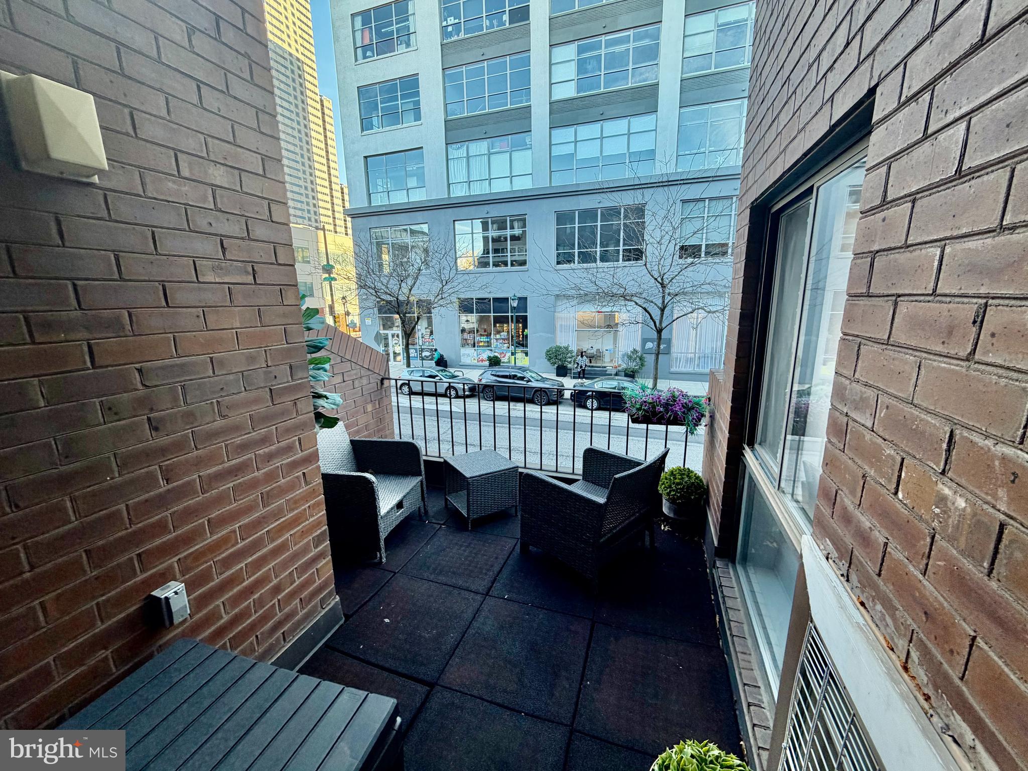 100 North 22nd Street, Unit 106 Philadelphia, PA 19103 - Photo 12 of 26 a view of a balcony with chairs