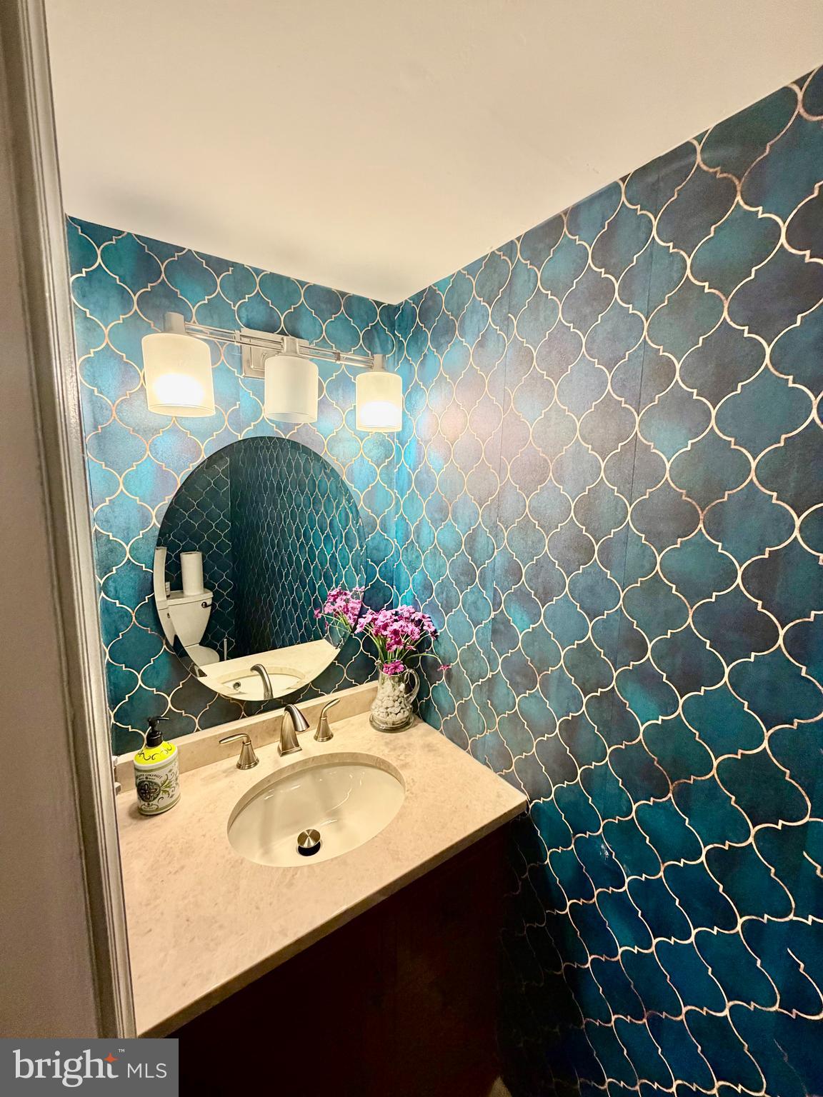 100 North 22nd Street, Unit 106 Philadelphia, PA 19103 - Photo 13 of 26 a bathroom with a sink mirror and vanity