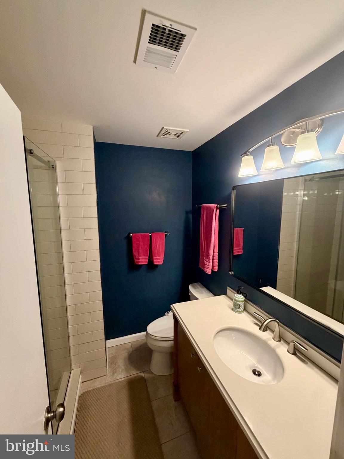 100 North 22nd Street, Unit 106 Philadelphia, PA 19103 - Photo 15 of 26 a bathroom with a sink and a mirror