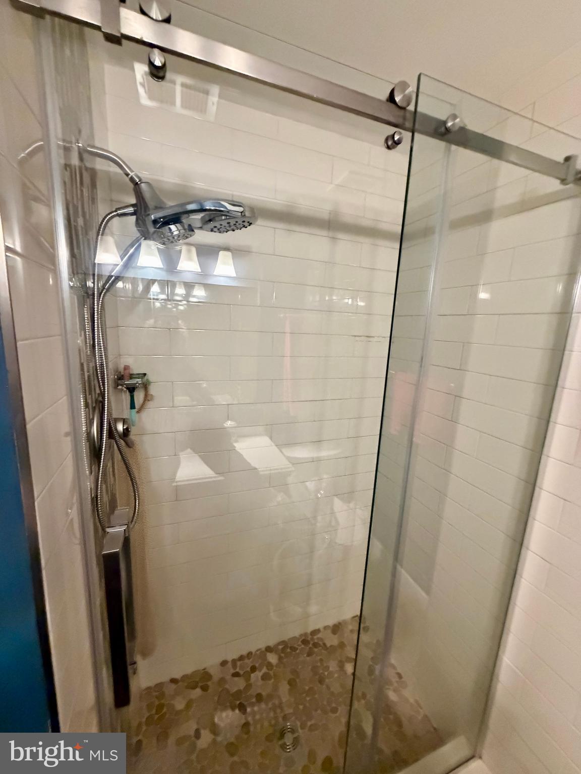 100 North 22nd Street, Unit 106 Philadelphia, PA 19103 - Photo 16 of 26 a bathroom with a shower