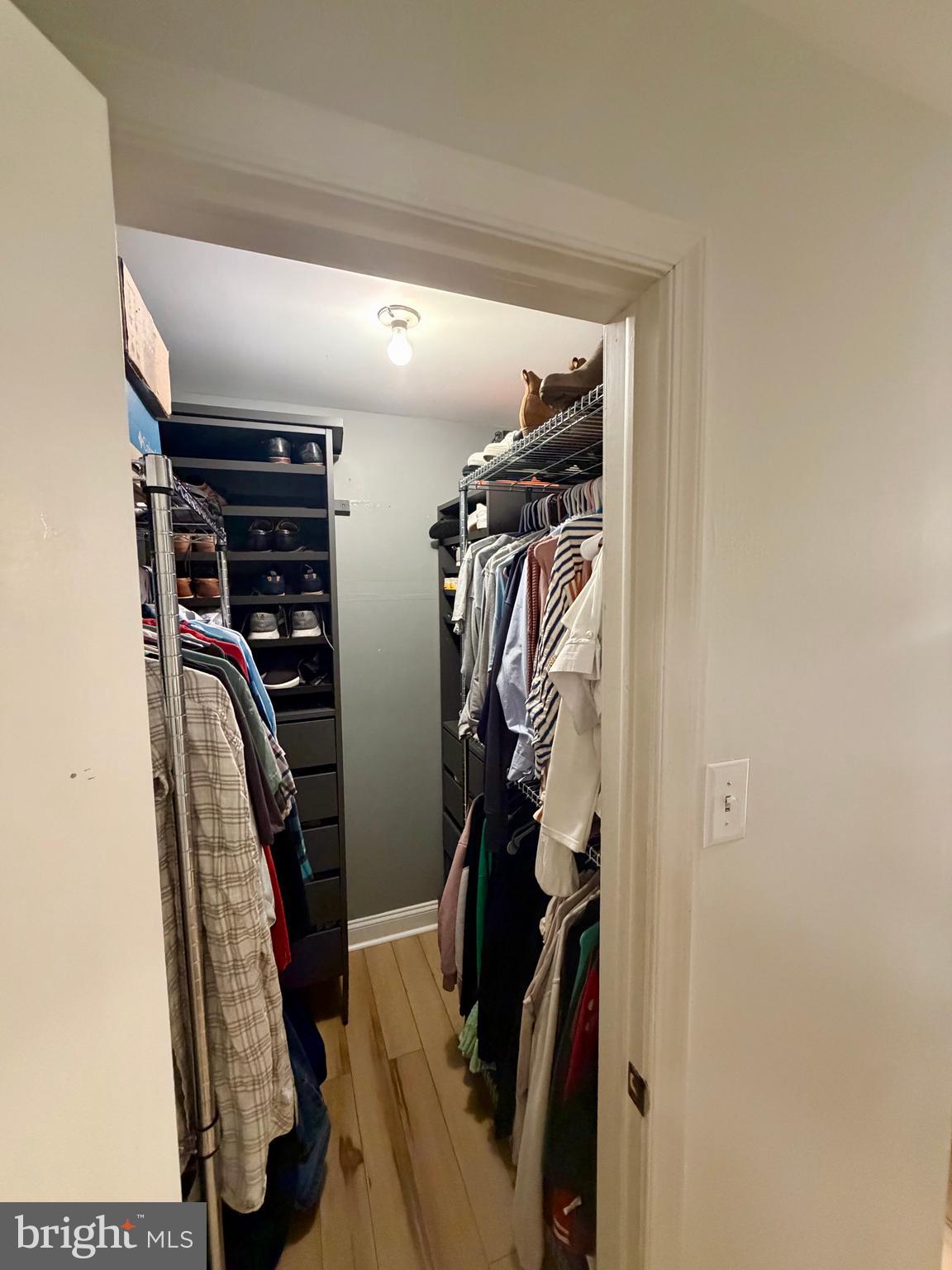 100 North 22nd Street, Unit 106 Philadelphia, PA 19103 - Photo 17 of 26 a view of walk in closet with clothes and shoes