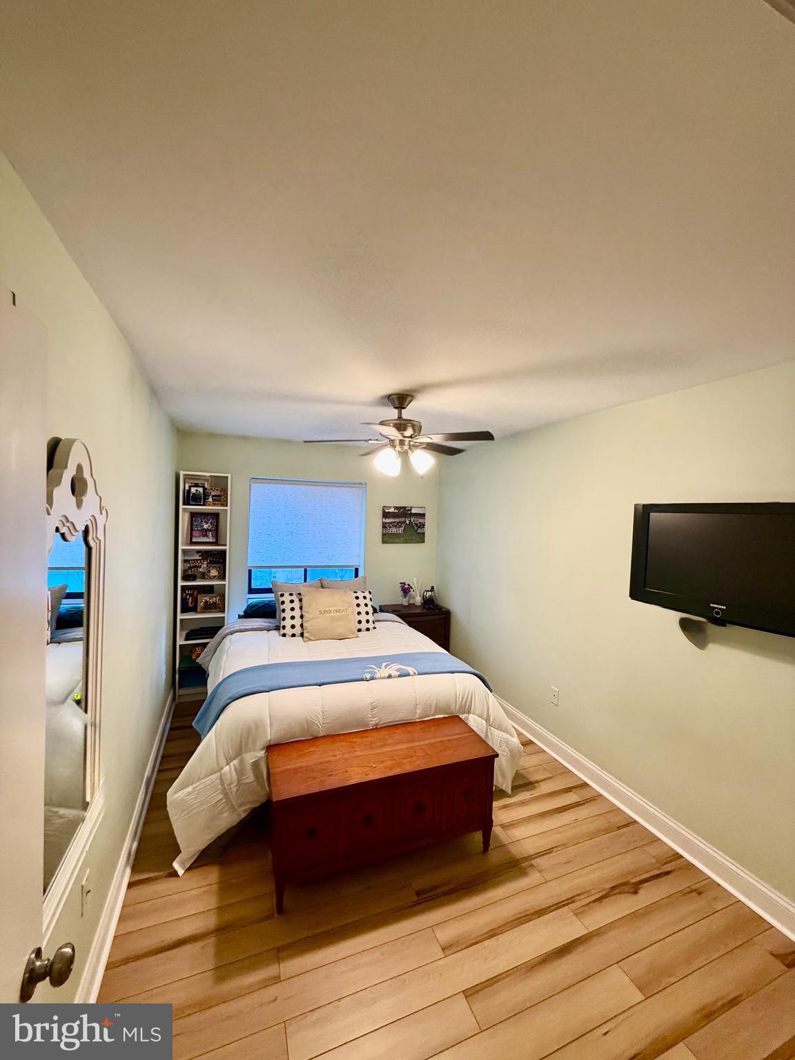 100 North 22nd Street, Unit 106 Philadelphia, PA 19103 - Photo 18 of 26 a bedroom with a bed and a flat screen tv