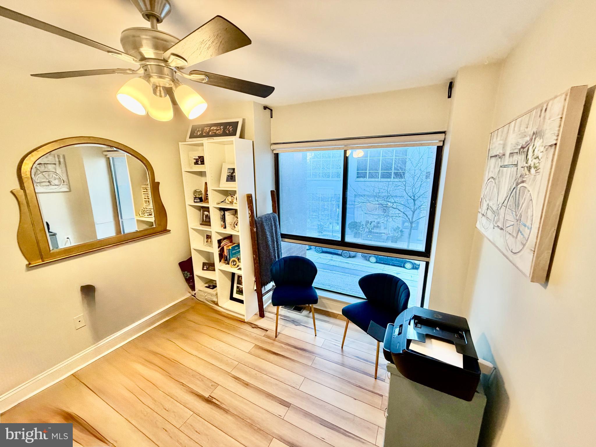 100 North 22nd Street, Unit 106 Philadelphia, PA 19103 - Photo 21 of 26 a view of living room with furniture and a window