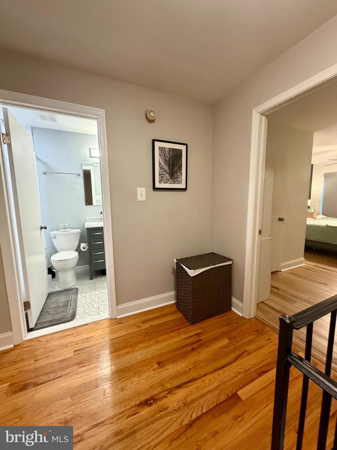100 North 22nd Street, Unit 106 Philadelphia, PA 19103 - Photo 22 of 26 a bedroom with a bed and wooden floor