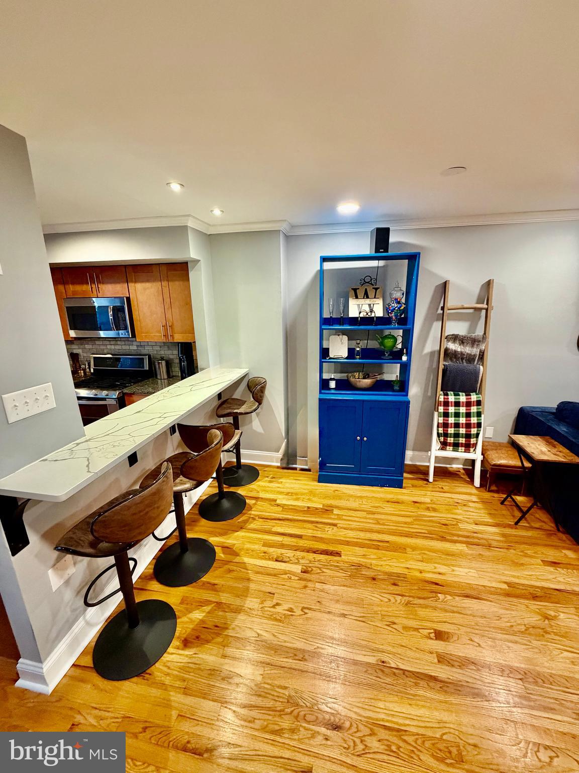 100 North 22nd Street, Unit 106 Philadelphia, PA 19103 - Photo 5 of 26 a room with furniture and a flat screen tv